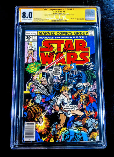 A collectible comic book issue of 'Star Wars' with a signed cover, featuring an action scene with multiple characters.