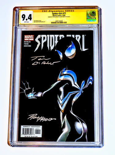  graded comic book displayed against a white background, with a clear plastic case, featuring a black cover with a illustration of Spider-Girl in a blue suit.