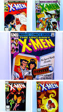 Load image into Gallery viewer, Collection of Marvel Comics Group X-Men comic book covers.
