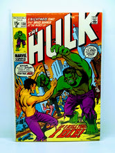 Load image into Gallery viewer, The cover of The Incredible Hulk #130 featuring the Hulk and another character in a fighting stance, with a cityscape background.
