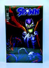 Load image into Gallery viewer, Comic book cover featuring a character with glowing eyes and chains, with &#39;Spawn&#39; branding.
