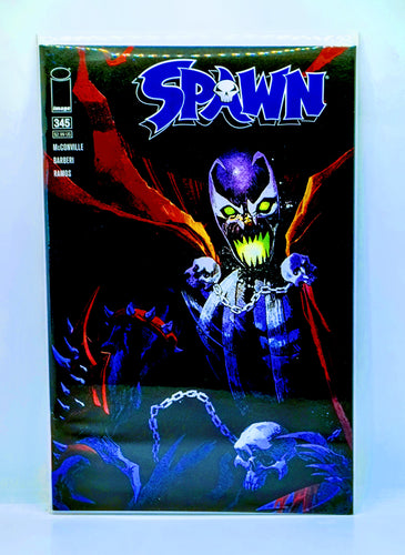 Comic book cover featuring a character with glowing eyes and chains, with 'Spawn' branding.